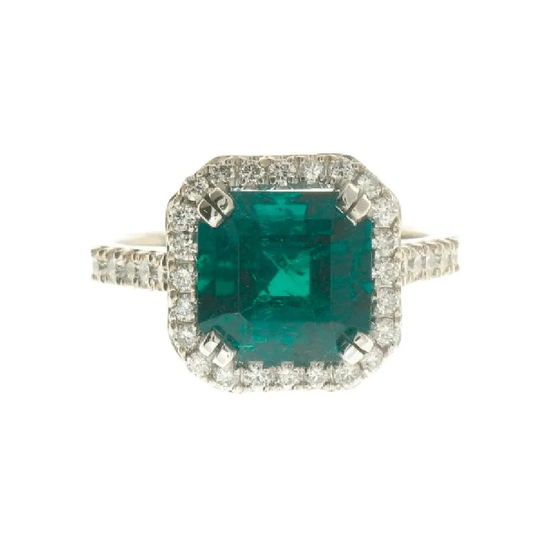 Open shank engagement rings-Emerald and Diamond Halo Ring